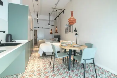 a kitchen and dining room with a table and chairs at District Key - Valencia, Olimpia 2 in Valencia