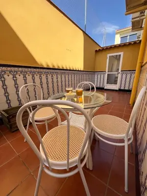 a balcony with a table and chairs on a patio at Casa Roma in Casinos