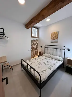 a bedroom with a bed in a room with a window at Apartamento La Fragua - A ESTRENAR - BRAND NEW in Chulilla