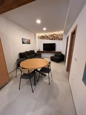 a living room with a table and a couch at Apartamento La Fragua - A ESTRENAR - BRAND NEW in Chulilla