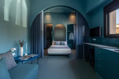 a bedroom with a bed in a blue room at Valencia Malvarrosa beach point blue in Valencia