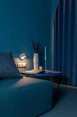 a blue room with a table and a couch at Valencia Malvarrosa beach point blue in Valencia