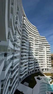 a large white building with a lot of windows at Gran Canet, relax y confort a pocos pasos del mar in Canet de Berenguer