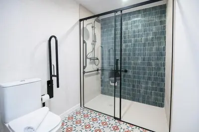 a bathroom with a shower and a toilet at District Key - Valencia, O Arocena 1 in Valencia