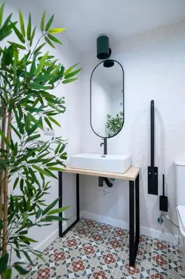 a bathroom with a sink and a mirror at District Key - Valencia, O Arocena 1 in Valencia