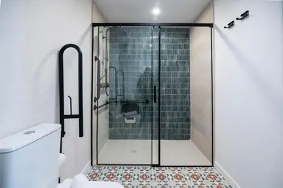 a shower with a glass door in a bathroom at District Key - Valencia, O Arocena 1 in Valencia