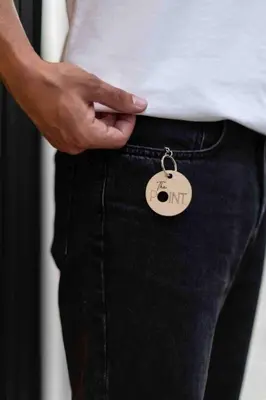 a man is wearing a key chain in his pocket at Valencia Malvarrosa point beige in Valencia