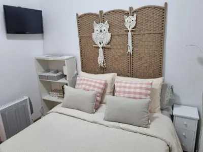 a bedroom with a bed with two owls on it at Les Dos Nines in Monserrat