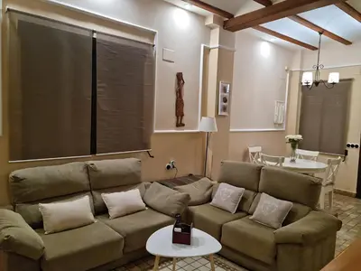 a living room with a couch and a table at Les Dos Nines in Monserrat
