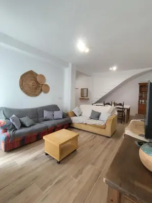 a living room with a couch and a table at Apartamento Rústico in Cortez de Pallas