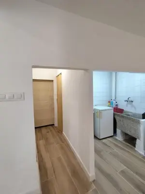 an empty room with a kitchen and a hallway at Apartamento Rústico in Cortez de Pallas