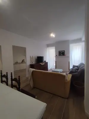 a living room with a couch and a table at Apartamento Rústico in Cortez de Pallas