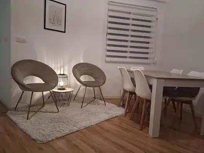 a dining room with chairs and a table and a table and a table and chairs at Lujoso Apartamento en Valencia 3 Dormitorios con Parking in Paterna