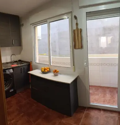 a kitchen with a counter with oranges on it at Cozy townhouse in Soneja in Soneja