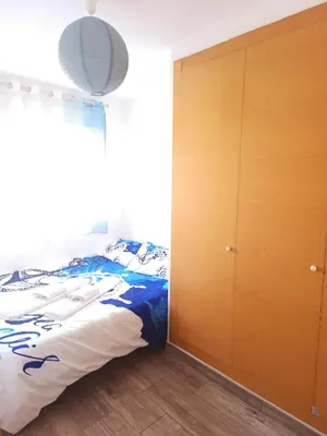 a bedroom with a bed and a closet at Cozy townhouse in Soneja in Soneja