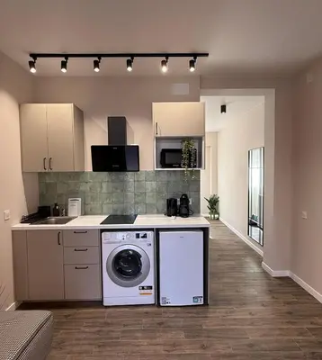 a kitchen with a washer and dryer in a room at Urban Soul Studio in Valencia