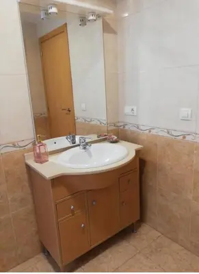 a bathroom with a sink and a mirror at DUPLEX COMPLETO 8 CAMAS La POBLA LLARGA in Puebla Larga
