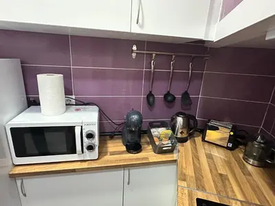 a blender sitting on a counter with a tray of food at Home Turia Pio Apartamento de 3 habitaciones in Valencia