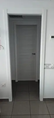 a door in a room with a tile floor at Playa La Patacona in Valencia