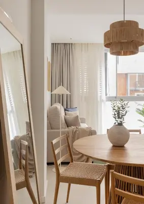 a living room with a table and chairs at Líbere Valencia Ruzafa in Valencia