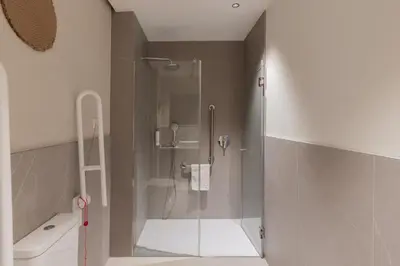 a shower with a glass door in a bathroom at Líbere Valencia Ruzafa in Valencia