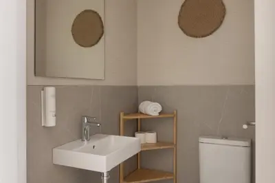 a bathroom with a sink and a toilet at Líbere Valencia Ruzafa in Valencia