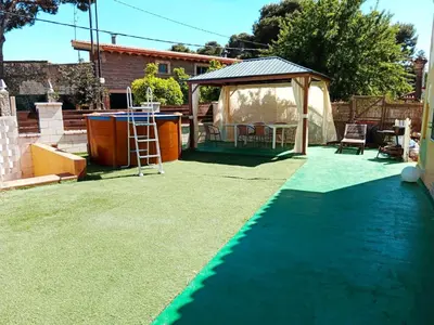 a backyard with a table and a gazebo at Vacansis Chalet 3 Vedat in Torrent