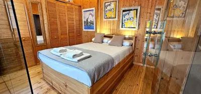 a bedroom with a bed with towels on it at Vacansis Atico Loft El Mercat in Valencia