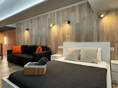 a living room with a bed and a couch at Cruilles 13 in Valencia