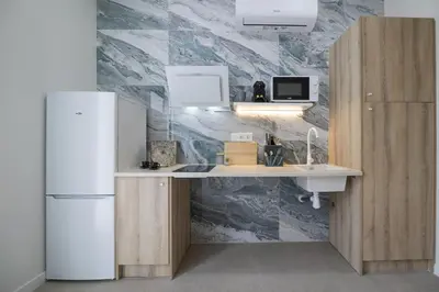 a kitchen with a sink and a refrigerator at PPA22 Loft Valencia - Acogedor loft cercano al metro Zona Ayora in Valencia