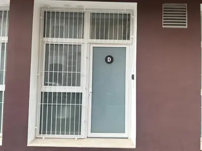 a door with a number on it in a window at Valencia Getaway - Jacuzzi, Space & Comfort in Valencia