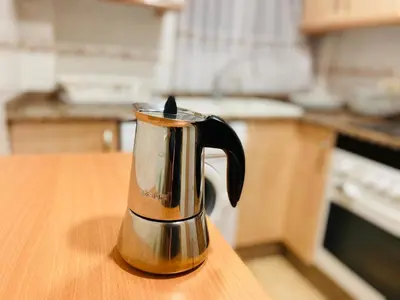 a coffee pot sitting on top of a table at Batflats-Palmeres Playa in Sueca