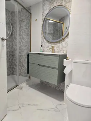 a bathroom with a sink and a mirror at eXperience Apartment Valencia in Valencia
