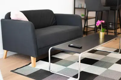 a living room with a couch and a coffee table at PV Loft Valencia - Modernos y cómodos estudios dúplex cerca a Russafa in Valencia