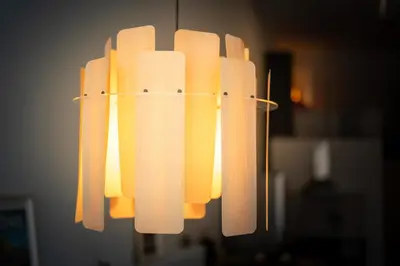 a chandelier with orange lights hanging from a ceiling at PV Loft Valencia - Modernos y cómodos estudios dúplex cerca a Russafa in Valencia