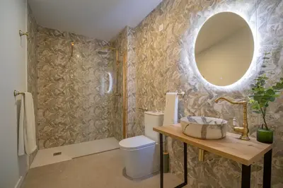 a bathroom with a toilet and a mirror on the wall at PA20A - Loft Valencia in Valencia