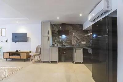 a kitchen with a sink and a desk in a room at PALX Loft Valencia - Estudio contemporáneo cerca de las Artes y las Ciencias in Valencia