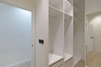 a white walk in closet with a glass door at GuestReady - Urban elegance in Valencia in Valencia