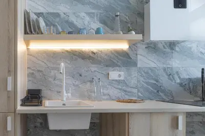 a kitchen with a sink and a counter top at UY - Loft Valencia Acogedores y modernos estudios cerca de la estación Joaquín Sorolla in Valencia