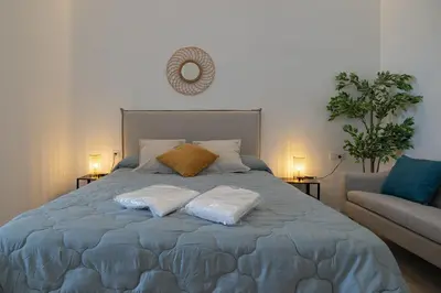 a bedroom with a bed with two pillows on it at UY - Loft Valencia Acogedores y modernos estudios cerca de la estación Joaquín Sorolla in Valencia