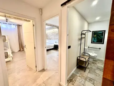 a hallway with a door leading to a bedroom at Turia Gardens & Science & Center in Valencia