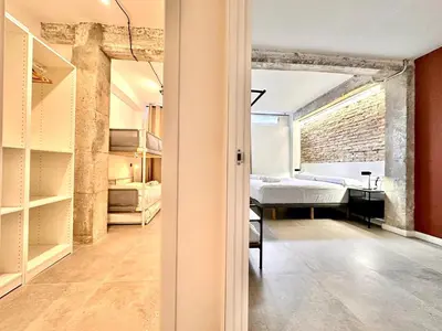a room with a bed and a room with a bedroom at Turia Gardens & Science & Center in Valencia
