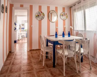 a dining room with a table and chairs at La Casa de la Cascada in Anna