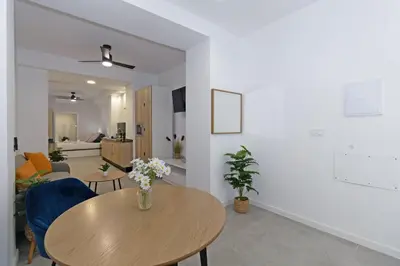 a living room with a table and a couch at GuestReady - A lovely studio in la Saidia Valencia in Valencia