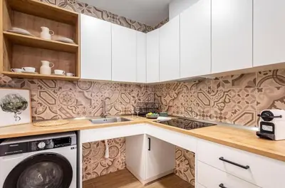 a kitchen with white cabinets and a washing machine at Lugre, Lovely flat close to center in Valencia