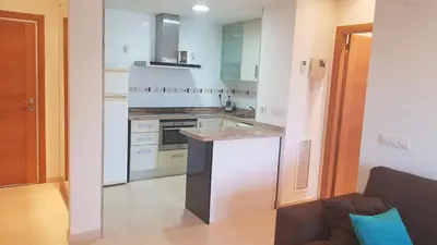 a kitchen with white cabinets and a counter top at Direct view to the beach , Parking , Terraza in Valencia