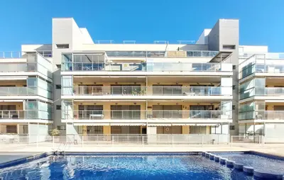 an apartment building with a swimming pool in front of it at Cozy Apartment In Moncofa in Moncófar