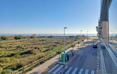 a car driving down a road next to a highway at Cozy Apartment In Moncofa in Moncófar
