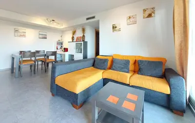 a living room with a couch and a table at Cozy Apartment In Moncofa in Moncófar