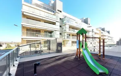 a playground on a balcony in front of a building at Cozy Apartment In Moncofa in Moncófar